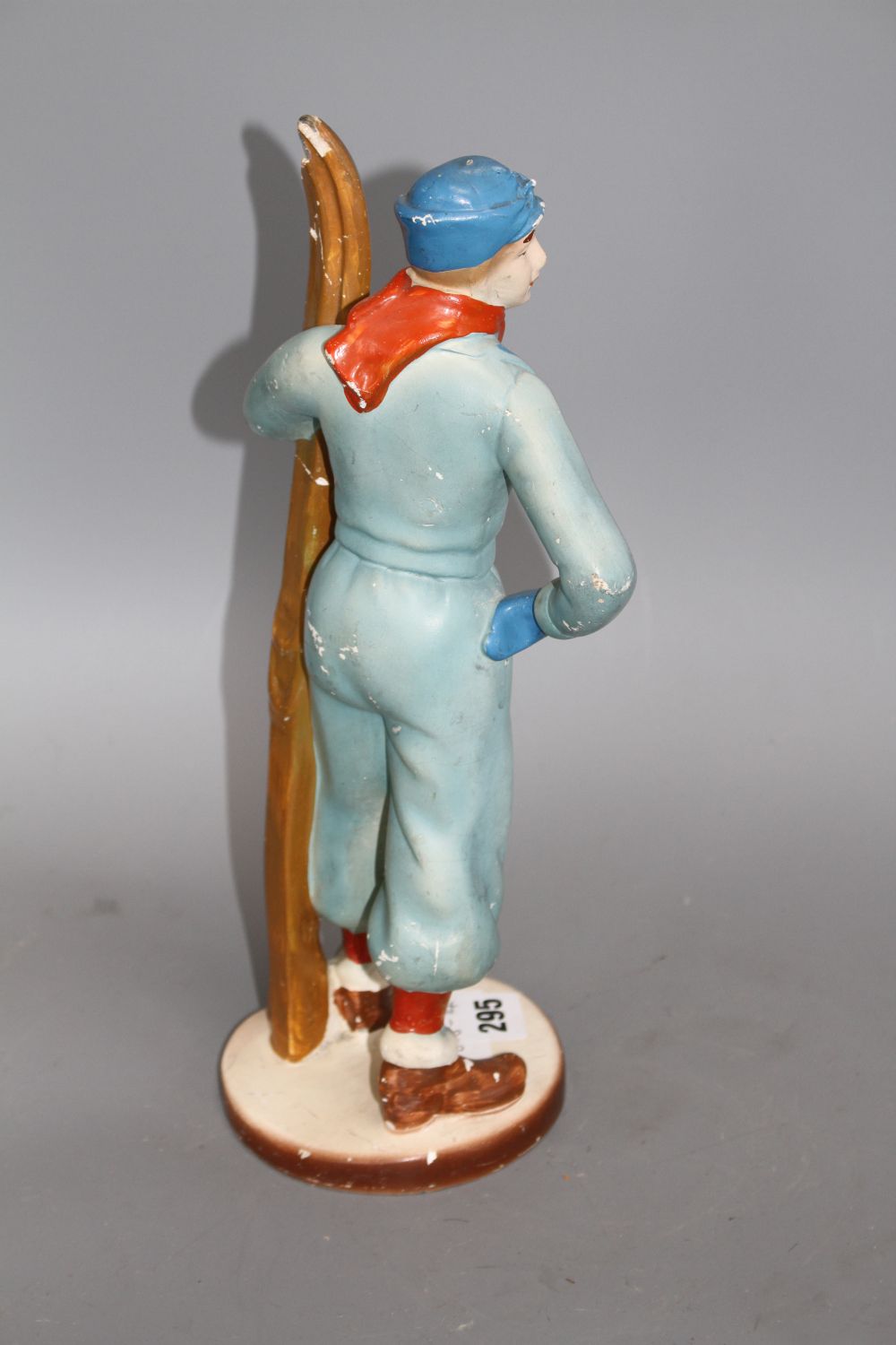 A 1930s painted plaster model of a skier, height 33cm